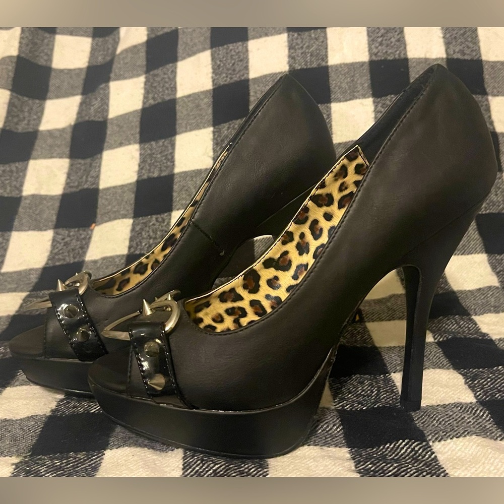 Demonia “Pixie-15” spiked peep toe high heel.